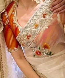 Orange Blouse With White Saree